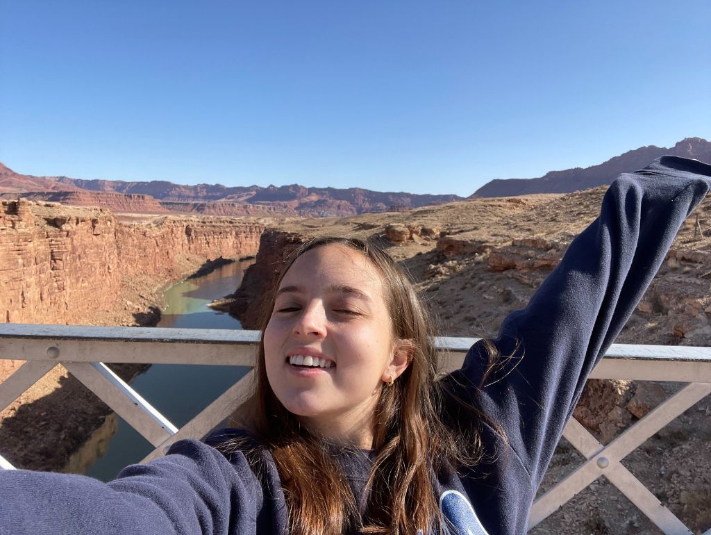 Image of Ava T. posing in front of the Grand Canyon.
