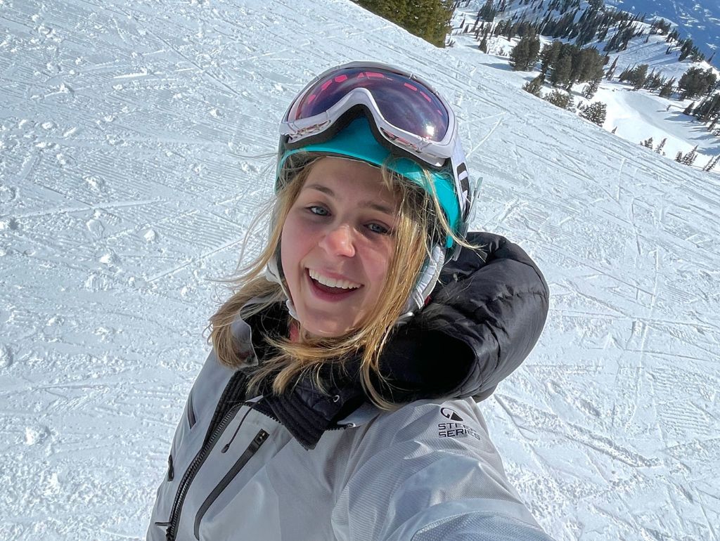 Selfie of Sylvia C. while snowboarding.