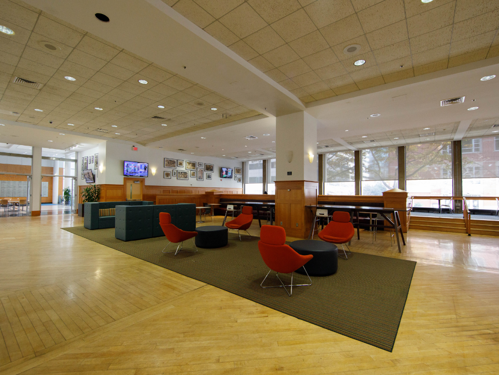 Columbian Square with a mix of seating options including banquettes, lounge chairs, and tables with chairs